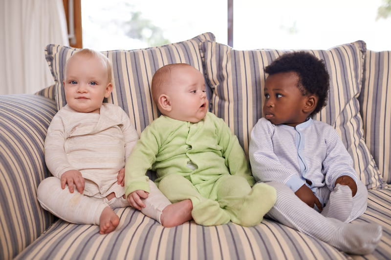 Three children in an image about immunization against respiratory syncytial virus (RSV) and the prevention of respiratory infections in children.
